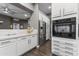 Bright kitchen with white cabinetry, stainless steel appliances, dark floors and a marble countertop at 26743 N 65Th Dr, Phoenix, AZ 85083