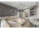 Inviting living room area with stone fireplace and open access to the kitchen and bar at 26743 N 65Th Dr, Phoenix, AZ 85083