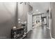 Inviting entryway with stylish decor leading to a living area featuring a stone fireplace at 26743 N 65Th Dr, Phoenix, AZ 85083