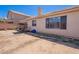 Exterior shot of a home with desert landscaping, a swing, and a covered patio at 2714 E Valencia Dr, Phoenix, AZ 85042