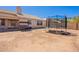 Wide backyard view, presenting a swing, sliding glass doors, and a privacy wall at 2714 E Valencia Dr, Phoenix, AZ 85042