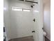 Modern bathroom showcasing tiled walls and floors, paired with black plumbing fixtures at 2714 E Valencia Dr, Phoenix, AZ 85042