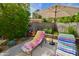 Inviting backyard with lounge chairs, desert landscaping and a shade umbrella at 3015 E Sells Dr, Phoenix, AZ 85016