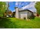 Green backyard featuring a lush lawn and a view of the swimming pool, umbrella, and poolside seating at 3015 E Sells Dr, Phoenix, AZ 85016