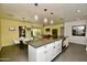 Kitchen and dining area with stone countertops, ample cabinet space, modern appliances, and pendant lighting at 3015 E Sells Dr, Phoenix, AZ 85016