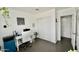 Bright office space with a white desk, rolling chair, storage closet, and ample space for productivity at 3015 E Sells Dr, Phoenix, AZ 85016