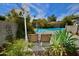 Relaxing backyard pool area with two lounge chairs and privacy landscaping at 3015 E Sells Dr, Phoenix, AZ 85016