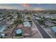 The aerial view showcases the beautiful mountain views, pool, and residential surroundings at 3121 E Sierra St, Phoenix, AZ 85028