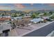 The aerial view displays the well-maintained home with a landscaped front yard and mountain views at 3121 E Sierra St, Phoenix, AZ 85028