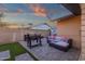Inviting backyard features a built-in grill and cozy seating area under string lights at 3121 E Sierra St, Phoenix, AZ 85028