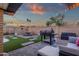 This spacious backyard features a built-in grill and an outdoor dining area at 3121 E Sierra St, Phoenix, AZ 85028
