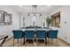 Dining room with a modern table, seating for eight, and stylish light fixtures at 3121 E Sierra St, Phoenix, AZ 85028