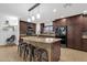 Updated kitchen boasting a center island with bar seating, stylish countertops, and modern appliances at 3121 E Sierra St, Phoenix, AZ 85028
