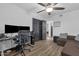 Versatile room featuring dual monitors, wood-look floors, and dark paneled doors at 3121 E Sierra St, Phoenix, AZ 85028