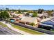 A well-maintained single-story home features a backyard pool and is surrounded by a secure block fence at 3140 N 114Th Dr, Avondale, AZ 85392