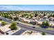 A serene neighborhood features single-story homes, mature trees, and well-kept landscaping at 3140 N 114Th Dr, Avondale, AZ 85392