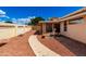 Well-maintained backyard with fountain, landscaping, rock, and walkway at 3140 N 114Th Dr, Avondale, AZ 85392