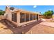 View of the enclosed patio and the rock landscaping in the backyard at 3140 N 114Th Dr, Avondale, AZ 85392