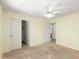 A bedroom featuring a ceiling fan, closet, natural light, and neutral tones at 3140 N 114Th Dr, Avondale, AZ 85392
