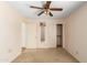 A bedroom with a ceiling fan, closet, natural light, and neutral tones at 3140 N 114Th Dr, Avondale, AZ 85392