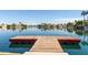 Waterfront dock provides easy access to the lake with nearby homes at 3140 N 114Th Dr, Avondale, AZ 85392