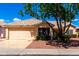 Well-kept residence with an attached garage, desert landscaping, and a pleasant front facade at 3140 N 114Th Dr, Avondale, AZ 85392