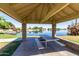Community gazebo offers a shady spot to enjoy lake views at 3140 N 114Th Dr, Avondale, AZ 85392