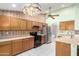 Bright kitchen equipped with stainless steel appliances, ample counter space, and plenty of cabinetry at 3140 N 114Th Dr, Avondale, AZ 85392