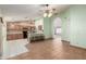 Spacious kitchen area with a breakfast bar, tiled flooring, and an adjoining bonus room at 3140 N 114Th Dr, Avondale, AZ 85392