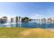 Beautiful lake view featuring fountains, mature trees, and waterfront homes at 3140 N 114Th Dr, Avondale, AZ 85392