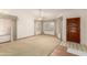 Inviting living room with classic curtains, large windows, and a tiled entry area at 3140 N 114Th Dr, Avondale, AZ 85392