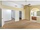 This primary bedroom includes a ceiling fan, ensuite bathroom, and closet for storage at 3140 N 114Th Dr, Avondale, AZ 85392