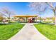 A well-maintained community playground with colorful equipment, shaded areas, and manicured lawns, perfect for Gathering fun at 3140 N 114Th Dr, Avondale, AZ 85392