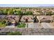 Aerial view of neighborhood homes, each featuring desert landscaping, driveways and mature trees at 3592 E Sandwick Dr, San Tan Valley, AZ 85140