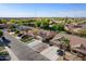 A picturesque view of an orderly neighborhood with well-kept homes, green lawns, and community park areas at 3592 E Sandwick Dr, San Tan Valley, AZ 85140