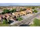 A high angle showcases a neighborhood with manicured lawns, mature trees and convenient residential street parking at 3592 E Sandwick Dr, San Tan Valley, AZ 85140