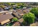 An aerial view shows a neighborhood with well-landscaped yards, mature trees, and proximity to neighborhood amenities at 3592 E Sandwick Dr, San Tan Valley, AZ 85140