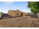 Large backyard with gravel landscaping and private fencing at 3592 E Sandwick Dr, San Tan Valley, AZ 85140