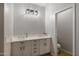 Bright bathroom with double sink vanity and modern lighting fixtures at 3592 E Sandwick Dr, San Tan Valley, AZ 85140
