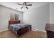 Cozy bedroom features a comfortable bed, ceiling fan and neutral tones at 3592 E Sandwick Dr, San Tan Valley, AZ 85140
