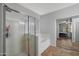 Stylish main bathroom featuring a glass shower and soaking tub at 3592 E Sandwick Dr, San Tan Valley, AZ 85140