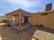 Outdoor patio with seating surrounded by low-maintenance gravel and landscaping at 3621 N 65Th Ave, Phoenix, AZ 85033