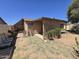 This backyard features a large covered patio with desert landscaping at 3621 N 65Th Ave, Phoenix, AZ 85033