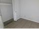 Cozy bedroom features tile flooring and ample closet space for organized storage solutions at 3621 N 65Th Ave, Phoenix, AZ 85033