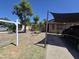Single-story home with xeriscaped front yard, mature trees and covered parking at 3621 N 65Th Ave, Phoenix, AZ 85033