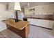 Functional kitchen featuring white cabinetry, ceiling fan, and a spacious island at 3621 N 65Th Ave, Phoenix, AZ 85033