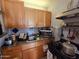 Well-organized kitchen with wooden cabinets, granite countertops, and modern appliances at 3621 N 65Th Ave, Phoenix, AZ 85033