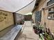 Relaxing outdoor patio space with shaded cover, greenery, and comfortable seating at 3621 N 65Th Ave, Phoenix, AZ 85033