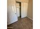 Bedroom featuring a closet and neutral-toned tile flooring for a clean and modern feel at 3645 N 71St Ave # 28, Phoenix, AZ 85033