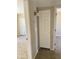 Hallway featuring tile floors and doors leading to the rooms at 3645 N 71St Ave # 28, Phoenix, AZ 85033